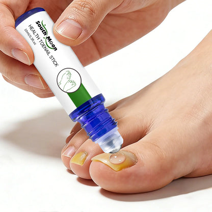 Applying toenail treatment liquid to discolored toenail with a roll-on applicator